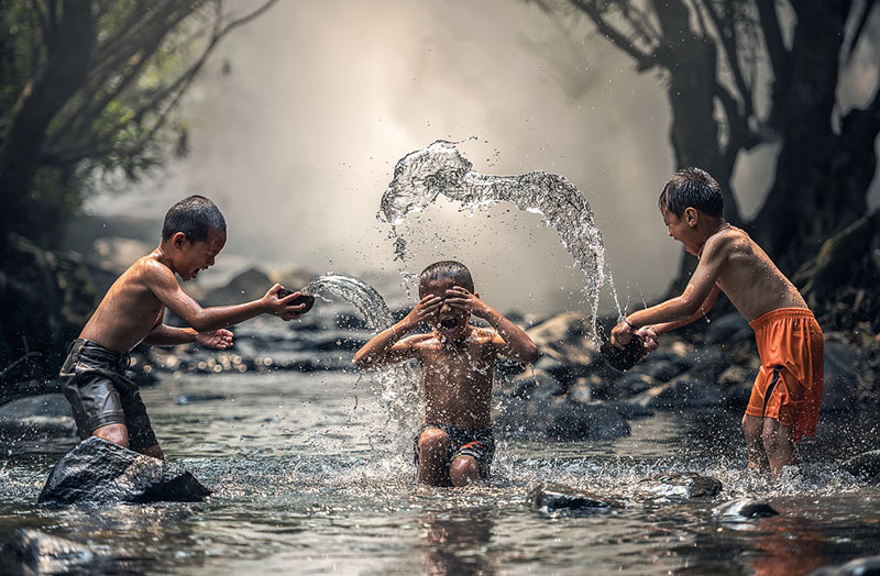 children laughing water splashing